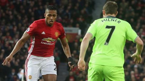 Antonio Valencia of Manchester United and James Milner of Liverpool