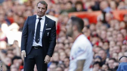 Brendan Rodgers looks on as Danny Ings falls to his knees