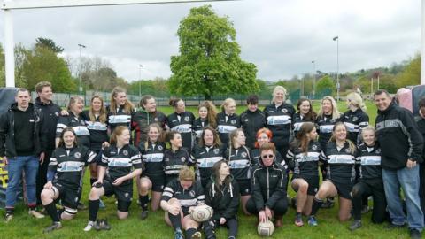Denise Shannon (in tinted glasses) and Gareth Waterfield (far right) with the Winscombe Rugby Club Women's team