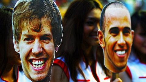 Sebastian Vettel and Lewis Hamilton masks