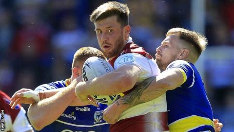 Joe Greenwood (centre) in action for Wigan