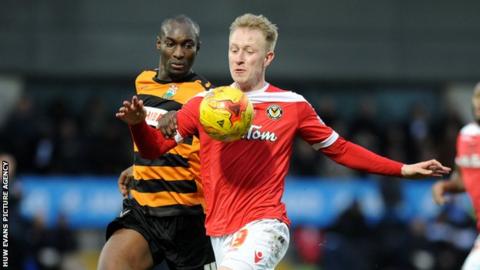 Newport's Scott Boden in action against Barnet