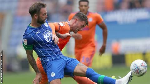 Gary Madine of Cardiff and Danny Fox of Wigan