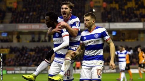 QPR debutant Ryan Manning (centre) and Jamie Mackie (right) helped celebrate Idrissa Sylla's goal at Molineux