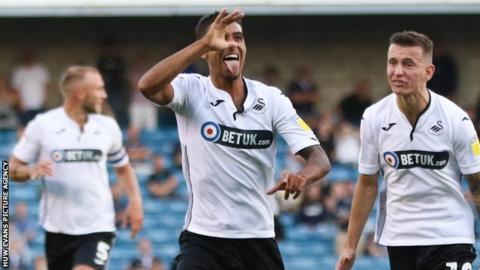 Kyle Naughton celebrates scoring for Swansea at Millwall