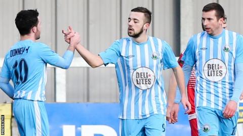 Warrenpoint players celebrate one of the five goals they scored against Crewe on 4 February