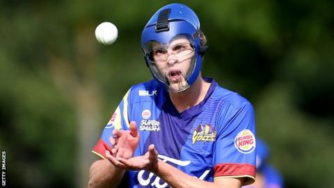 Otago Volts bowler Warren Barnes wears a protective mask during a match