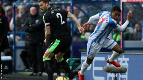 Bournemouth captain Simon Francis in action against Huddersfield