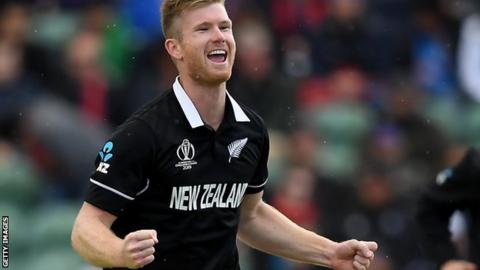 New Zealand's Jimmy Neesham celebrates taking a wicket