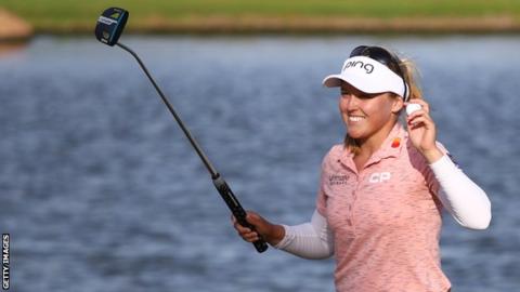 Brooke Henderson celebrates victory at the Lotte Championship