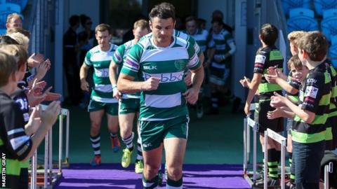 Blair Campbell leads out Guernsey