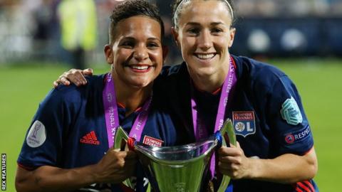 Shanice van de Sanden and Lucy Bronze of Lyon celebrate with the Women's Champions League trophy
