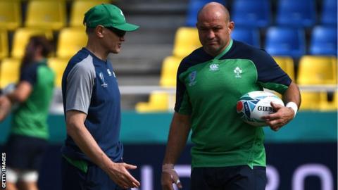 Joe Schmidt talks to Ireland skipper Rory Best during Friday's captain's run in Fukuoka