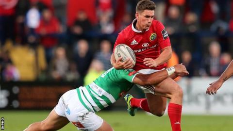 Treviso's Sam Christie tackles Munster fly-half Ian Keatley