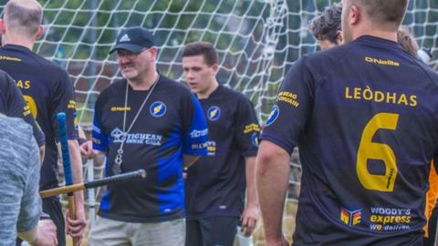 Iain Sinclair coaches his players