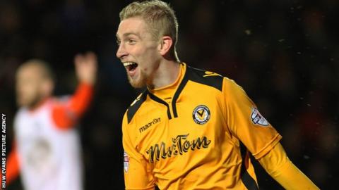 Oliver McBurnie celebrates his second goal for Newport