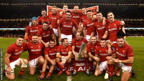 Wales celebrate after completing a clean sweep of autumn victories