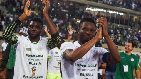 Captain John Mikel Obi applauds Nigerian fans after securing a World Cup place on Saturday
