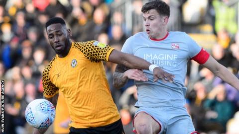 Newport's County Jamille Matt in action against Swindon's Tom Broadbent