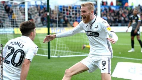 Swansea City striker Oli McBurnie celebrates scoring against Reading with Dan James (left)