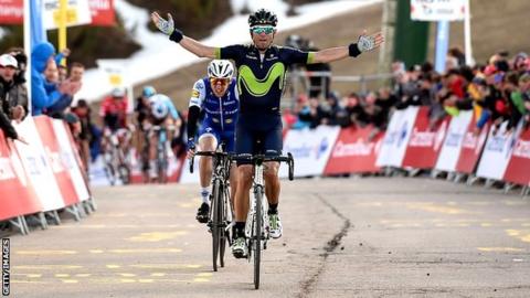 Movistar's Spanish rider Alejandro Valverde (R) celebrates as he crosses first the finish line followed by Quick Step Floors' Irish rider Daniel Martin