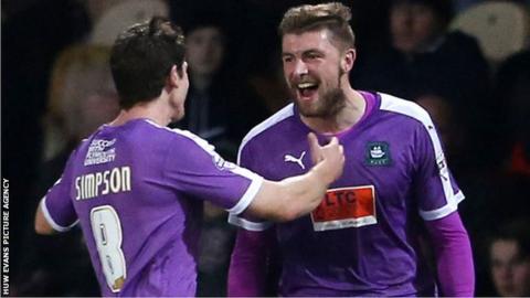 Ryan Brunt celebrates his goal at Rodney Parade