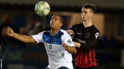 Guillaume Keke shields the ball from Ryan Morris