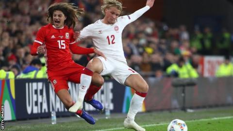 Ethan Ampadu is fouled by Denmarlks Kasper Dolberg