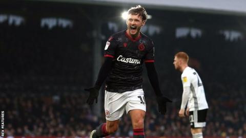 Reading's John Swift celebrates his first-half goal against Fulham