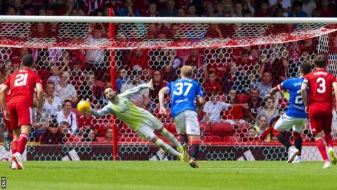 James Tavernier scores his penalty for Rangers
