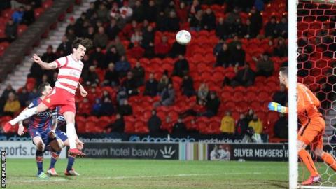 Doncaster's John Marquis heads in his first goal