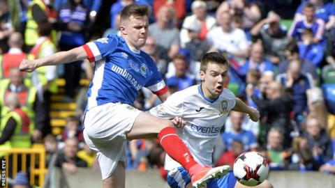 Linfield's Niall Quinn and Brad Lyons of Coleraine in action during the Irish Cup final