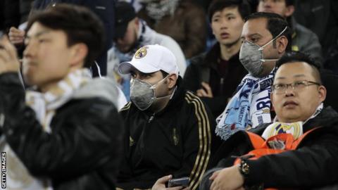 Some Real Madrid fans wore protective masks when their side first met Manchester City in the Champions League