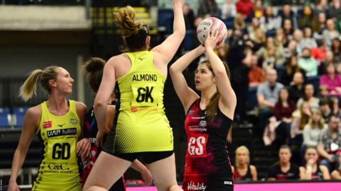 Bethan Goodwin of Strathclyde shoots on goal as Kerry Almond of Manchester Thunder attempts to block during the Vitality Netball Superleague match between Strathclyde Sirens and Manchester Thunder at Emirates Arena