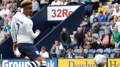 Callum Robinson scoring a goal for Preston