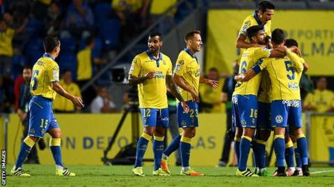 Las Palmas players celebrate scoring against Real Madrid