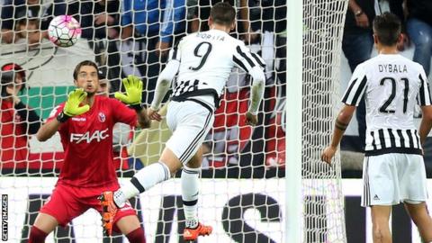 Alvaro Morata heads a goal for Juventus