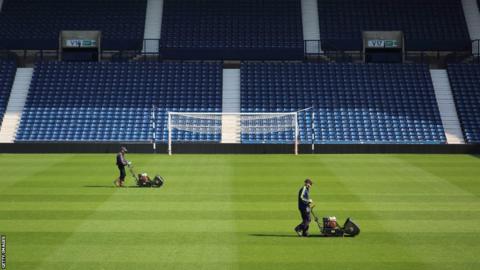 Groundsmen prepare the pitch at the Hawthorns Stadium, home of West Bromwich Albion