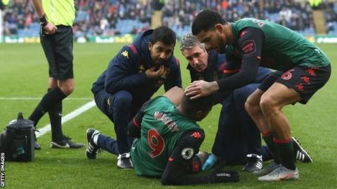 Wesley receiving treatment on the pitch at Turf Moor