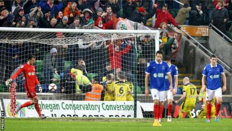 Cliftonville fans celebrate at Windsor Park after Jay Donnelly score the winning goal