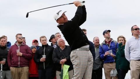 McDowell hits a shot on the 16th hole in the third round