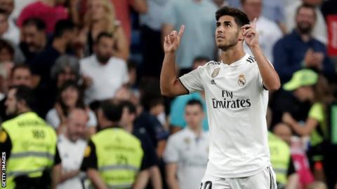 Real Madrid's Marco Asensio points to the sky after scoring against Espanyol