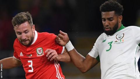 Wales' Paul Dummett and Republic of Ireland's Cyrus Christie compete for the ball