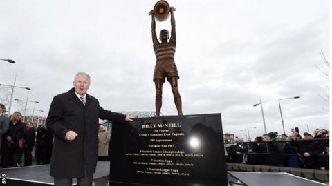 Billy McNeill stands alongside his statue