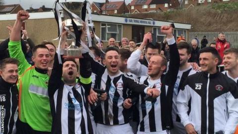 Llandudno players celebrate winning the Cymru Alliance title at Penycae