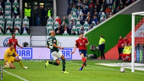 Robert Lewandowski scores for Bayern Munich at Wolfsburg