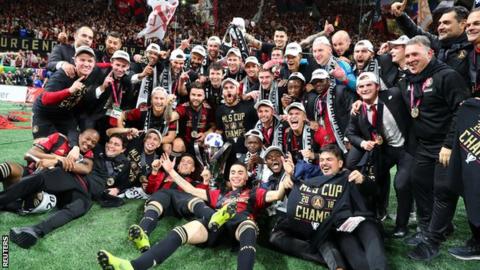 Atlanta United players celebrate after winning the MLS Cup