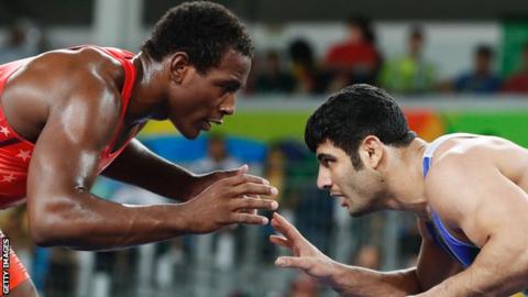 J'den Cox and Alireza Karimi prepare to wrestle at Rio 2016