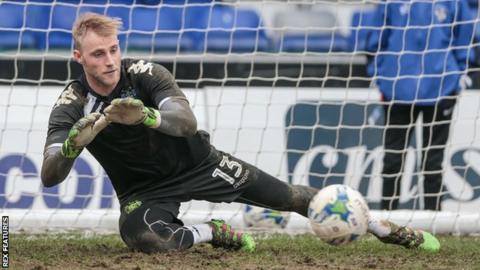 Rob Lainton's penalty save just before half-time proved crucial for Wrexham