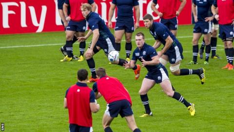 Scotland's Stuart Hogg receives the ball at training